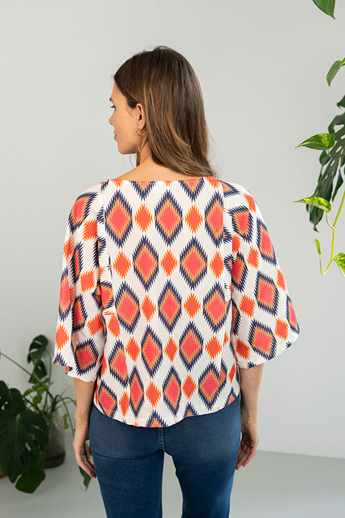 Blusa fluida de estampado geométrico con manga murciélago