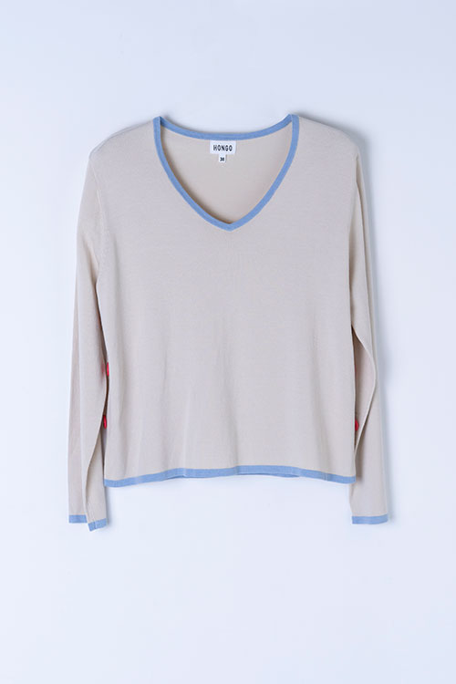 Jersey fluido escote pico con contraste azul